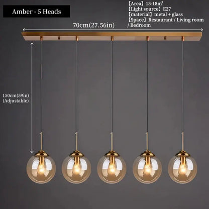 Modern amber glass pendant light with five spherical bulbs and brass fixtures in polished steel glass pendant light trio for dining room
