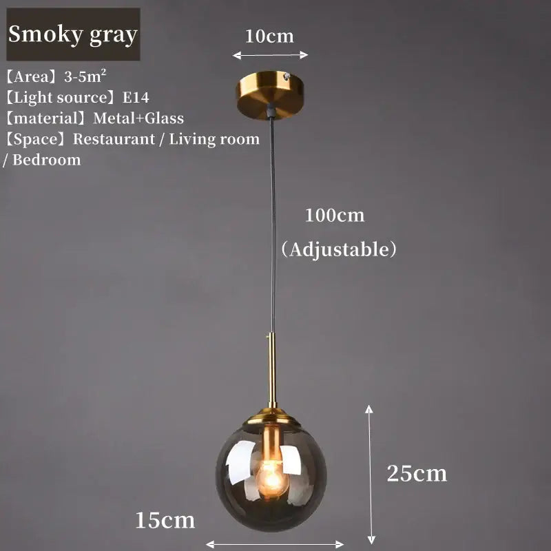 Polished steel glass pendant light trio featuring smoky gray glass and brass fixture with adjustable chain for dining room