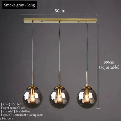 Smoke gray three-light pendant light with polished steel brass accents and spherical glass globes for dining room