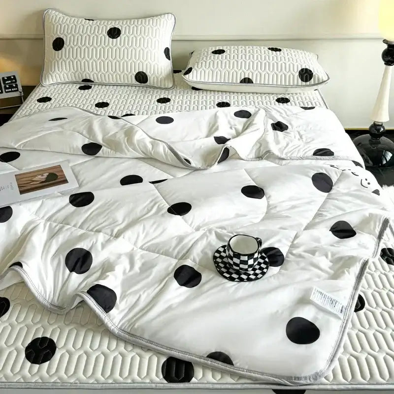 White quilted cool comforter with black polka dots and subtle texture in polka dot smile comforter set