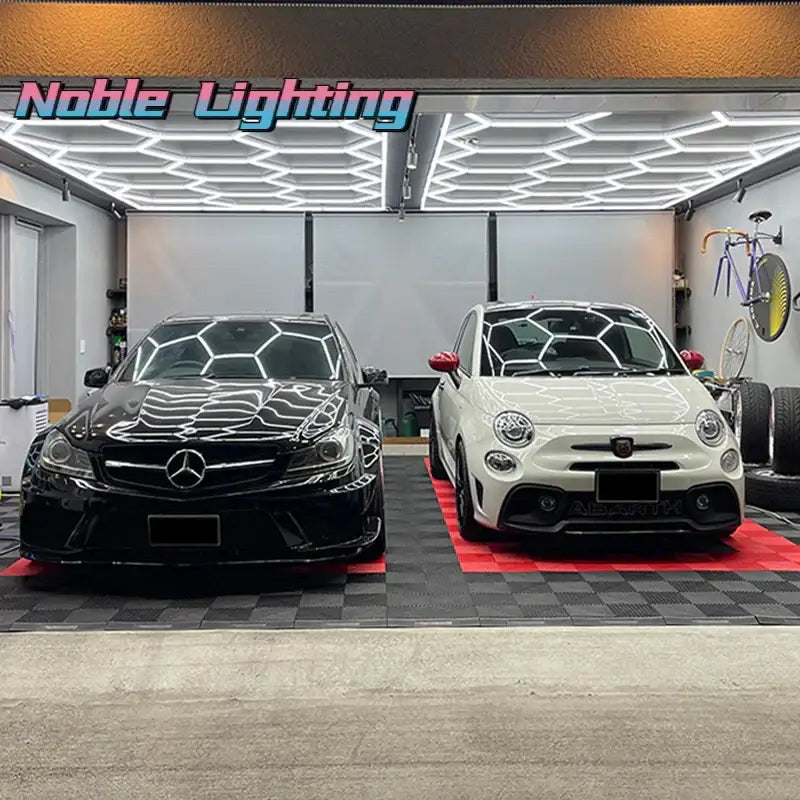 Black and white mercedes-benz c-class sedan with glossy finish parked beside white fiat 500 under decorbites geometric led lights