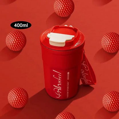 Red 400ml coffee thermos bottle with white flip-top lid and carrying strap featuring cursive text for portable use