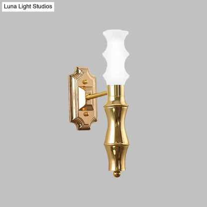 Gold-finished brass bamboo wall sconce with frosted glass shade and e27 bulb base for living room lighting