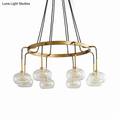 DecorBites™ post-modern island chandelier with gold finish, clear glass globes, five lights, and black cord suspension