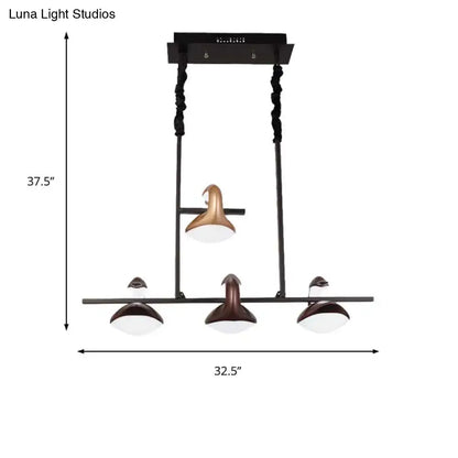 Modern black and bronze multicolored hanging pendant light with three shades and linear chandelier design for restaurants
