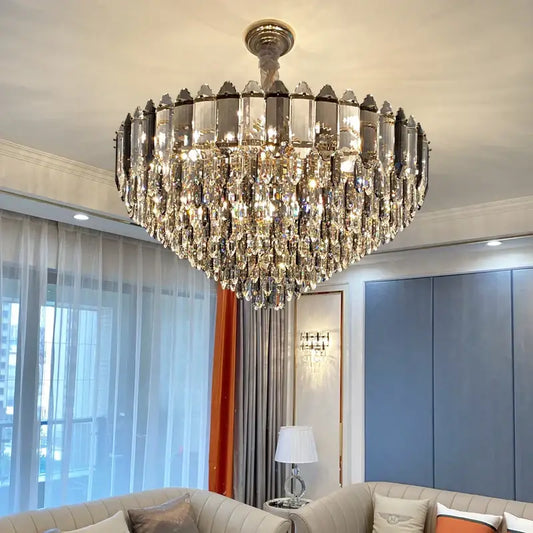 Post modern silver and brass decorbites crystal chandelier with tiered clear and silver-toned faceted crystals
