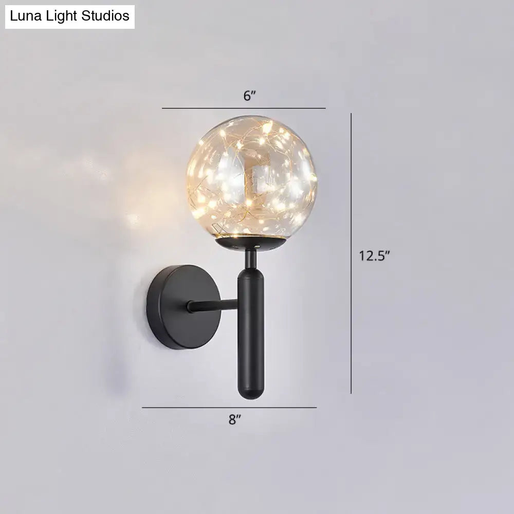 Postmodern black metal wall sconce with a prismatic glass shade and warm led fairy lights for modern style bedroom lighting