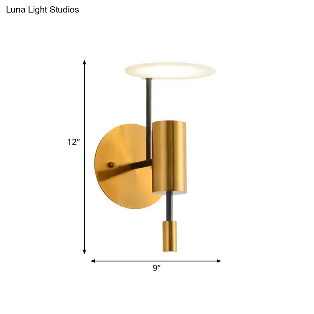 Postmodern black and gold brass tube wall light with a cylindrical body and frosted glass shade fixture height for bedroom use