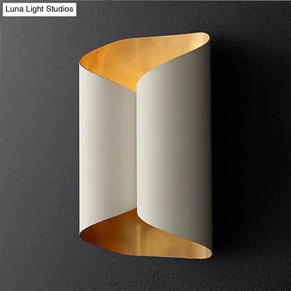 Postmodern black and gold roll metal wall lamp with sleek curved design, off-white exterior, and warm gold interior lining