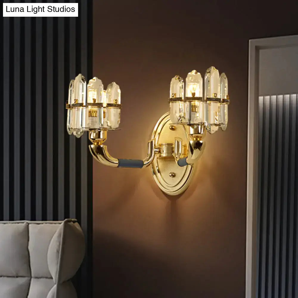 Postmodern blue and gold crystal wall mount lamp featuring a gold-toned multi-armed wall mount with clear glass shades