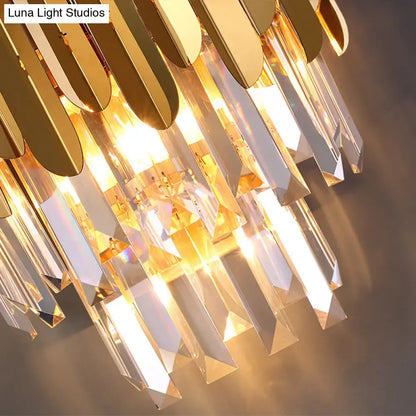 Postmodern brass tiered flush wall sconce with gold-toned crystal cascading design for bedroom lighting