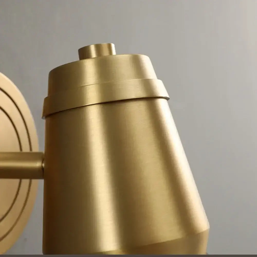 Postmodern brass wall lamp with conical tapered design and concentric rings for bedroom decorbites brass wall spotlight