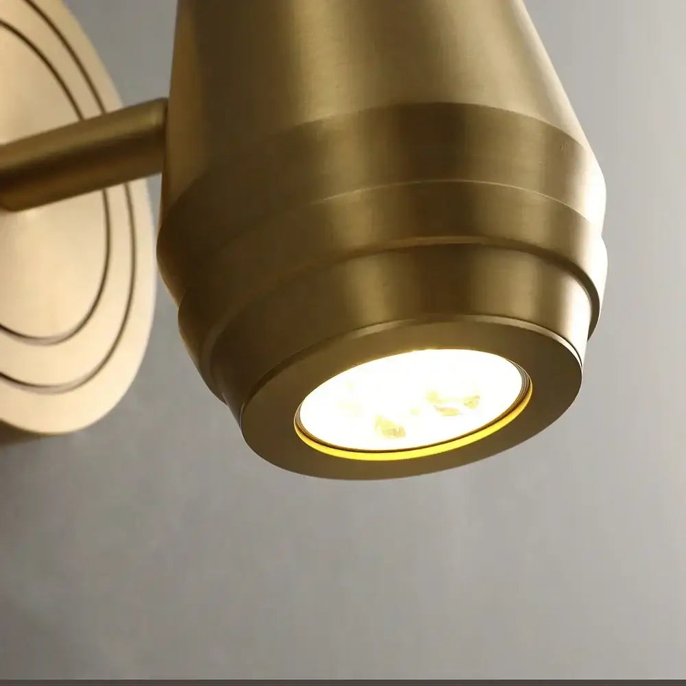 Postmodern brass wall lamp with concentric ring detailing and warm glowing led bulb for bedroom spotlight decorbites brass wall lamp
