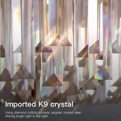 Postmodern clear and dark tiered decorbites crystal chandelier featuring imported k9 crystal prisms refracting vibrant light