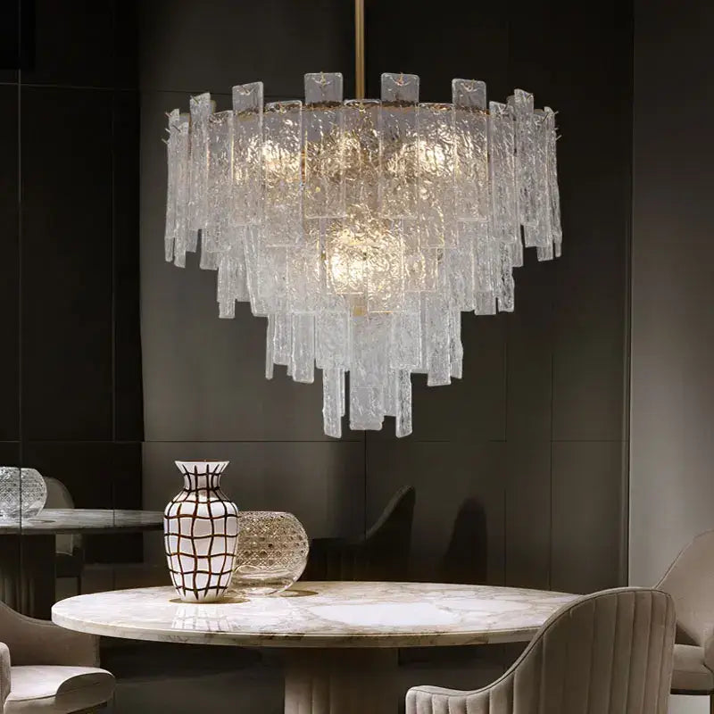 A modern decorbites crystal chandelier with frosted glass rods in concentric tiers for dining room lighting