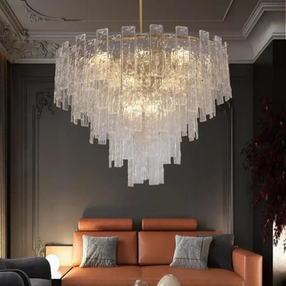 A postmodern decorbites crystal chandelier with cascading frosted glass rods emitting a warm glow for dining rooms