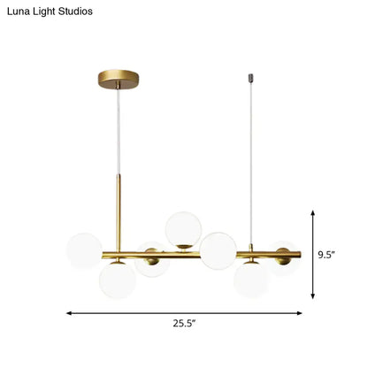 Modern brass-finished pendant light with clear glass globe shades from decorbites postmodern kitchen collection
