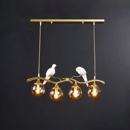 DecorBites sleek postmodern gold-toned pendant light with white ceramic bird deco and amber glass globes for 110v-120v use