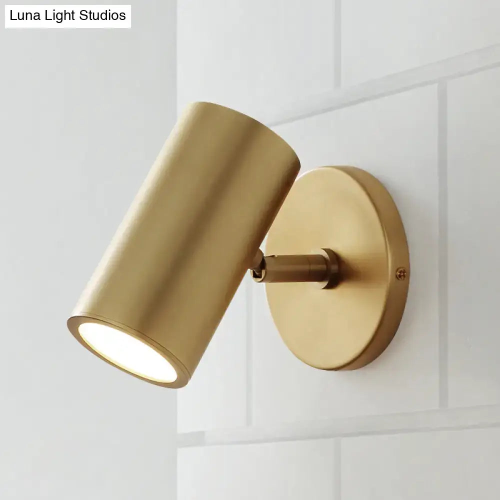 Gold-finished brass cylindrical wall light with sleek modern design ideal for bedroom reading inches fixture
