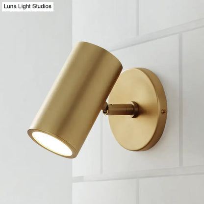 Gold-finished brass cylindrical wall light with sleek modern design ideal for bedroom reading inches fixture