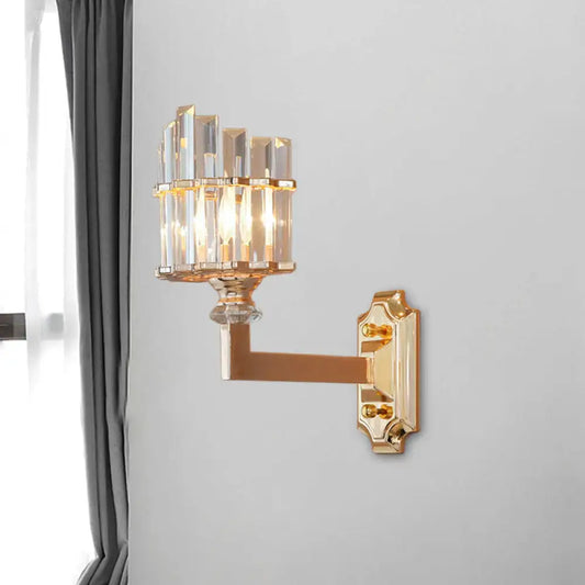 Postmodern gold single wall light with clear faceted crystal rods in an upward-facing fan pattern wall mounted lamp