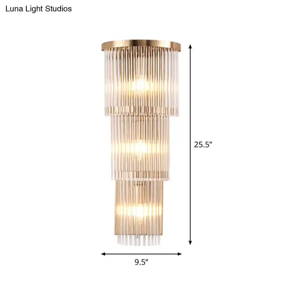 A postmodern gold crystal triangle tiered wall light with clear glass rods for chic living space illumination