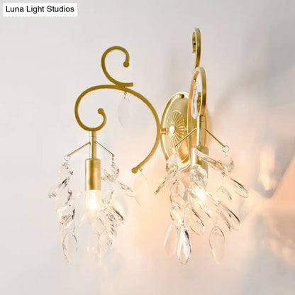 Postmodern gold curve arm sconce light with ornate curved arms and crystal leaf accents for living room use