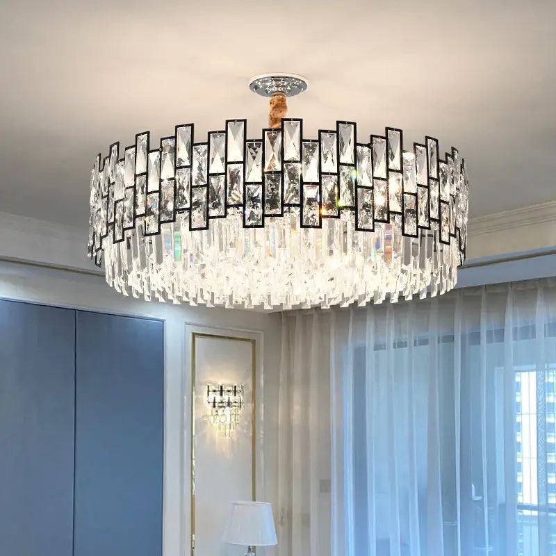 A modern black metal decorbites crystal chandelier with rectangular prisms and cascading glass droplets for living rooms