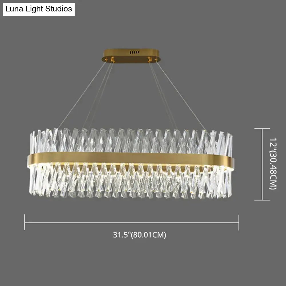 Postmodern gold finish pendant light with oval shape clear k9 crystal prisms and central brass ring fixture width