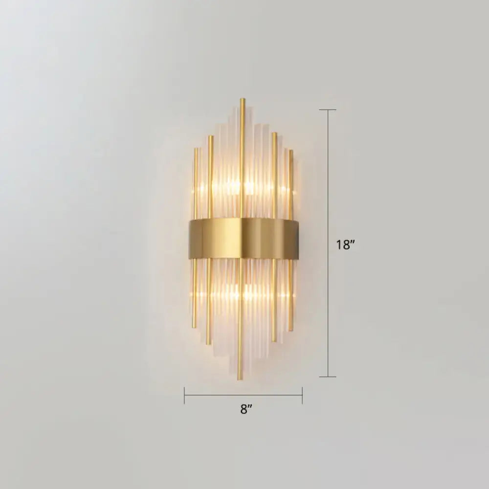 Gold-toned postmodern wall sconce with vertical k9 crystal glass rods and metallic band for living room lighting