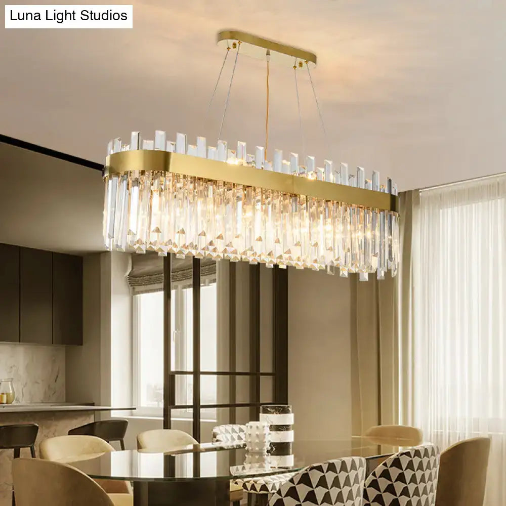 Postmodern gold oval island lighting fixture with clear crystal prisms on a sleek frame for 110v-120v use