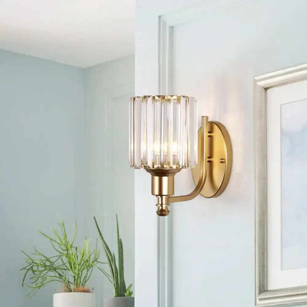 Postmodern gold wall lamp with a prismatic crystal shade composed of vertical crystal prisms for bedroom sconce lighting