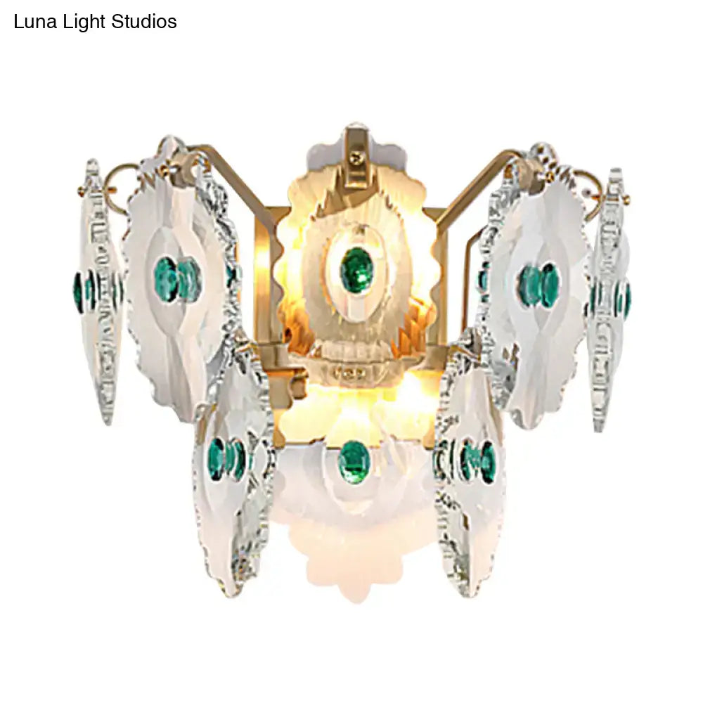 Postmodern green gold gem crystal wall sconce with emerald gemstones and faceted glass panels in a golden inch fixture width