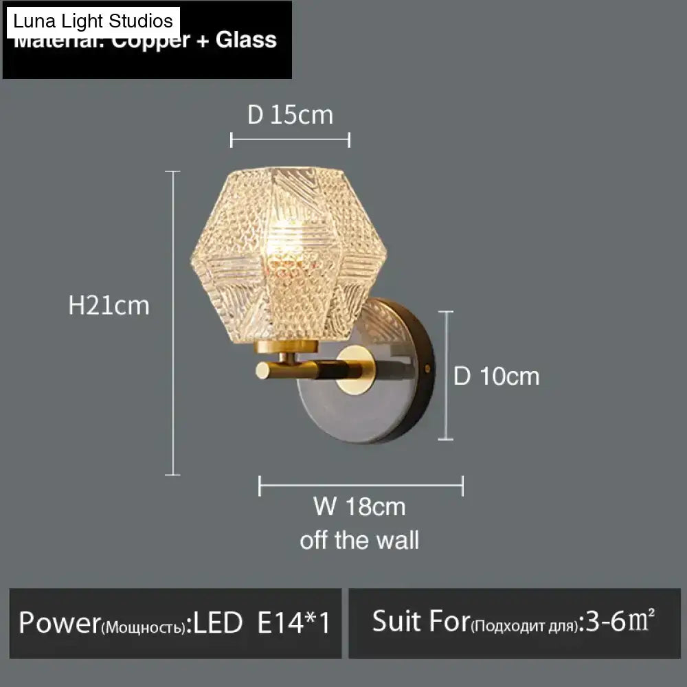 A postmodern luxury led wall lamp with a hexagonal textured glass shade and copper metal bracket for bedroom lighting