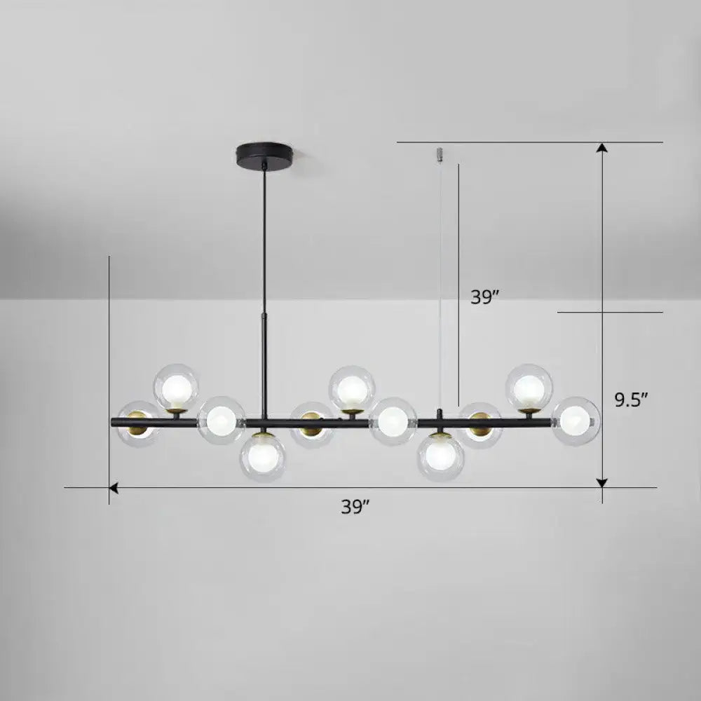 Black metal DecorBites LED island pendant light with clear glass globe bulbs and gold-toned accents in clear smoke grey