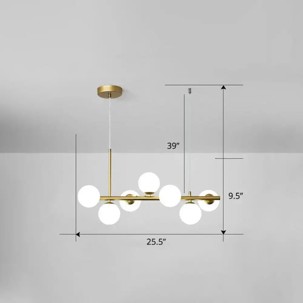 Gold-toned DecorBites LED island pendant light with seven frosted glass globe bulbs in smoke grey cognac finish