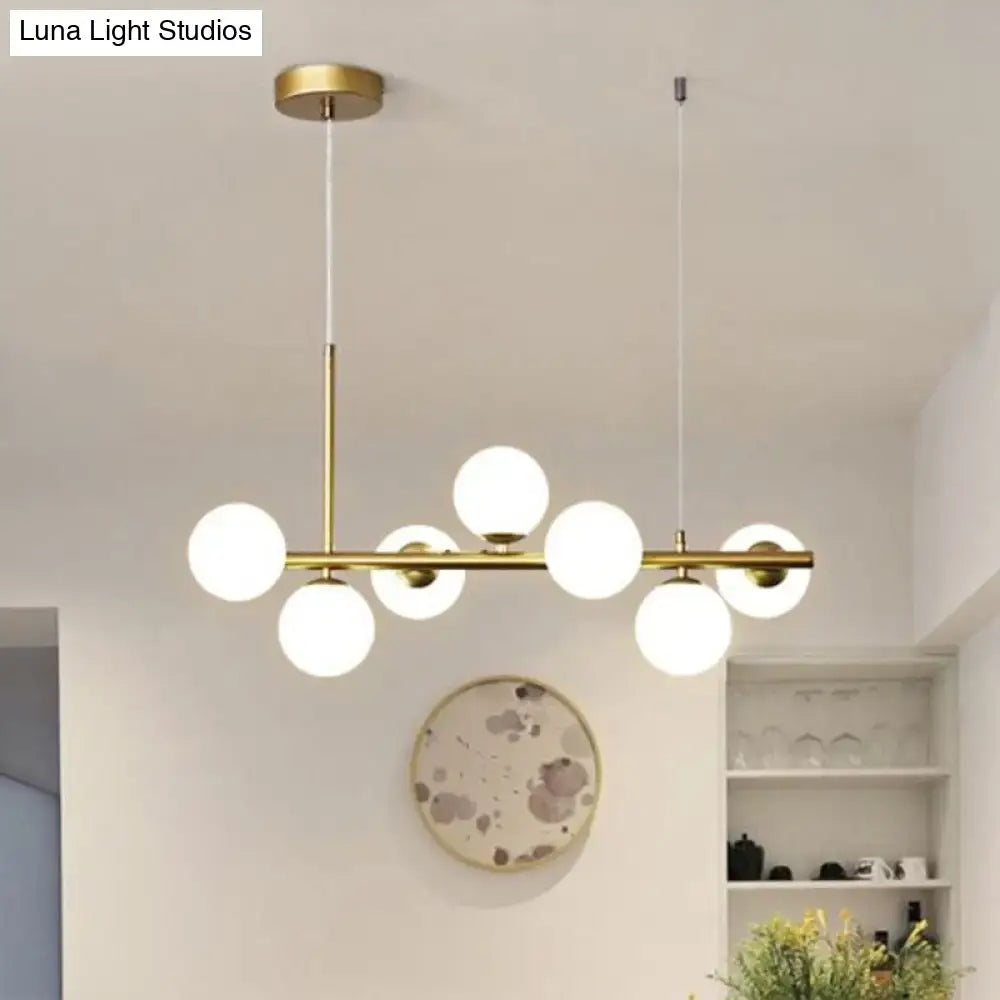 Decorbites™ led island pendant light with modern brass frame and six frosted smoke grey cognac glass globe bulbs
