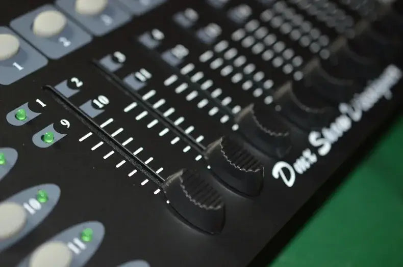 Professional black dmx controller with illuminated green led indicators and tactile faders for stage lighting and moving head spotlights