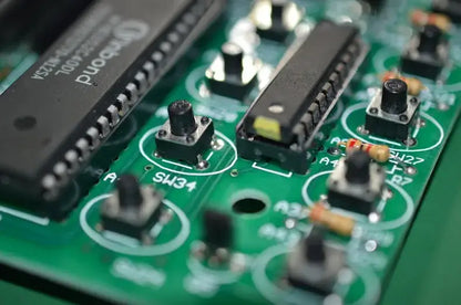 Professional black dmx controller featuring a black integrated circuit chip on a green pcb for stage lighting and moving head spotlights