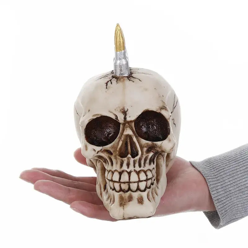 Punk beige resin skull head living room statue featuring a metallic bullet mohawk and detailed dark eye sockets and teeth