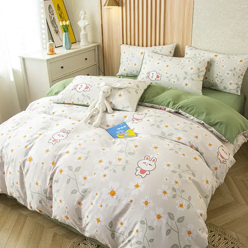 White duvet cover with playful bunny pattern and green vines paired with purple and blue leaf print bedding set