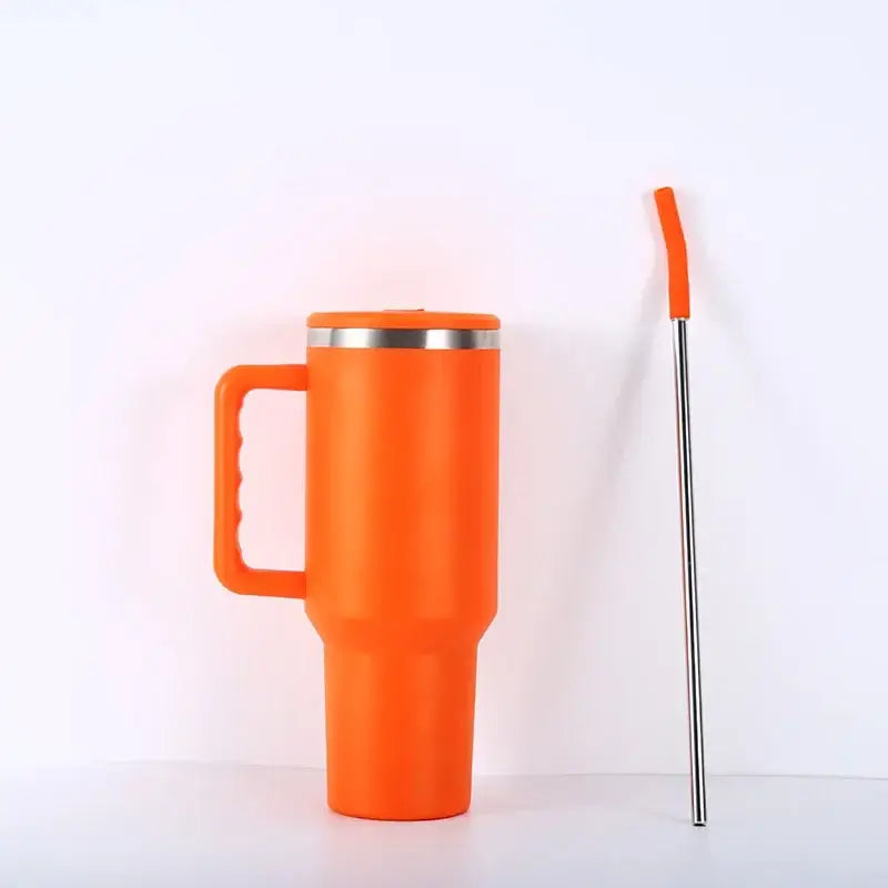 Bright orange insulated stainless steel travel mug with silver rim handle and orange-tipped steel sippy cup straw