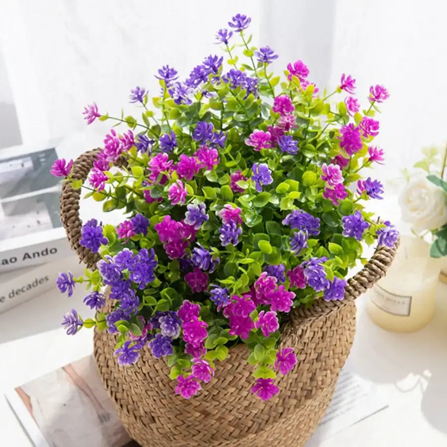 A woven wicker basket filled with purple and pink decorbites artificial eucalyptus plant for wedding and living room decor