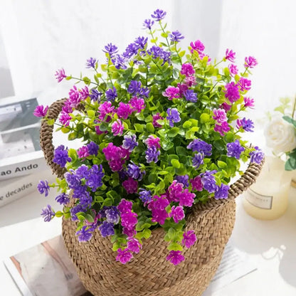 A woven wicker basket filled with purple and pink decorbites artificial eucalyptus plant for wedding and living room decor