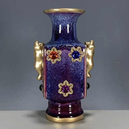 A glossy deep purple jun porcelain gilded gemstone vase with gold handles and floral motifs for living room decor