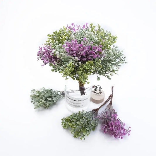 A decorbites artificial flower vase featuring a delicate purple and green foliage bouquet in clear glass with mountains cactus print