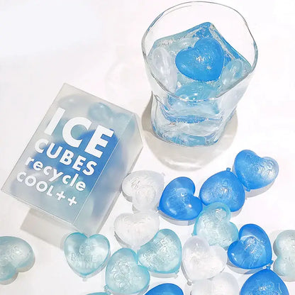 Blue and clear heart-shaped ice cubes made with a purple heart ice cube mold kitchen reusable tray
