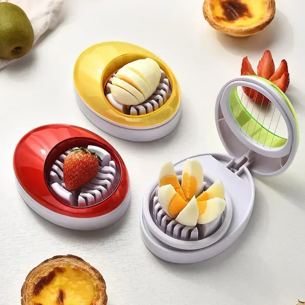 Purple rotating blade egg cutter slicer with colorful oval shape and segmented chamber for evenly slicing eggs or fruits