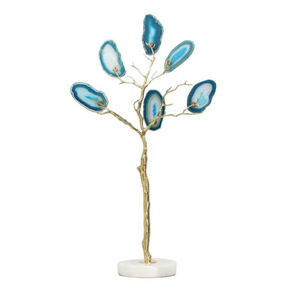 Decorative art piece featuring a golden agate tree with blue translucent agate slices for living room decor