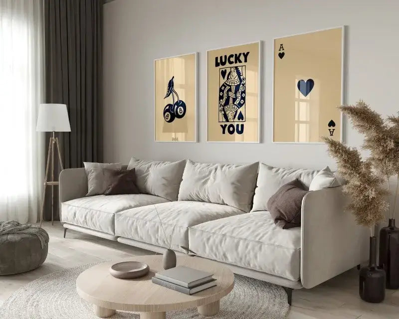 Beige modern sectional sofa with plush cushions and dark brown accent pillows beside DecorBites™ 3-piece hearts wall art set